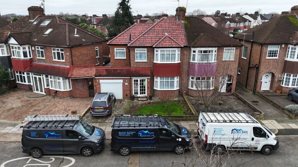 Residential street with roofing vans parked.