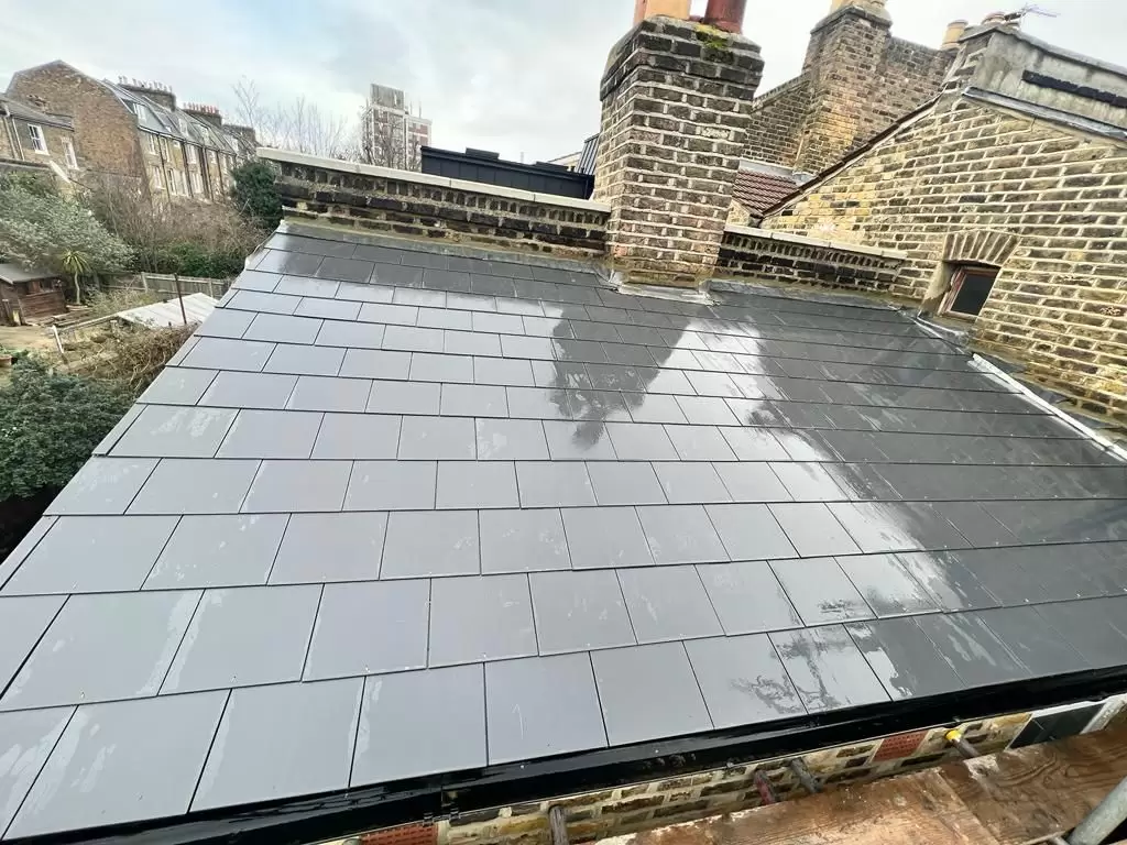 Freshly installed black slate roof tiles.